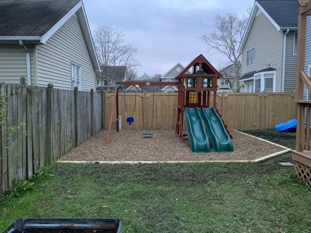 Freshly improved family yard with lawn and landscape beds